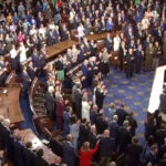 “No Kings” crowd gives King Charles standing ovation